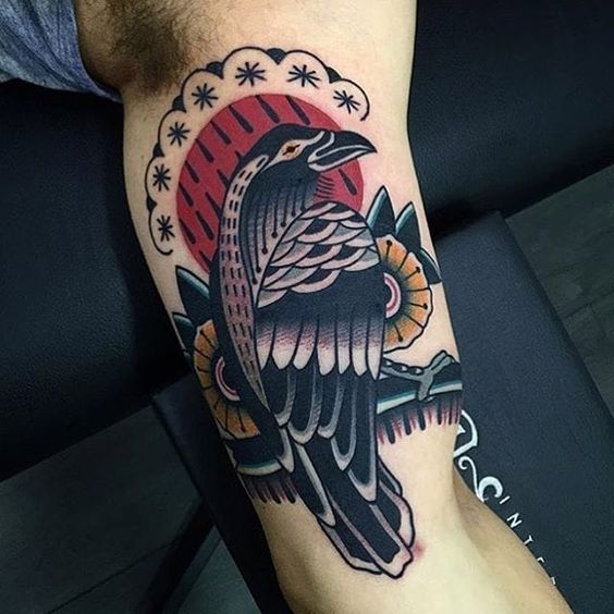 Blood moon and black raven arm tattoo