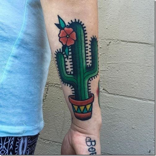 Cactus with a flower tattoo on the right forearm