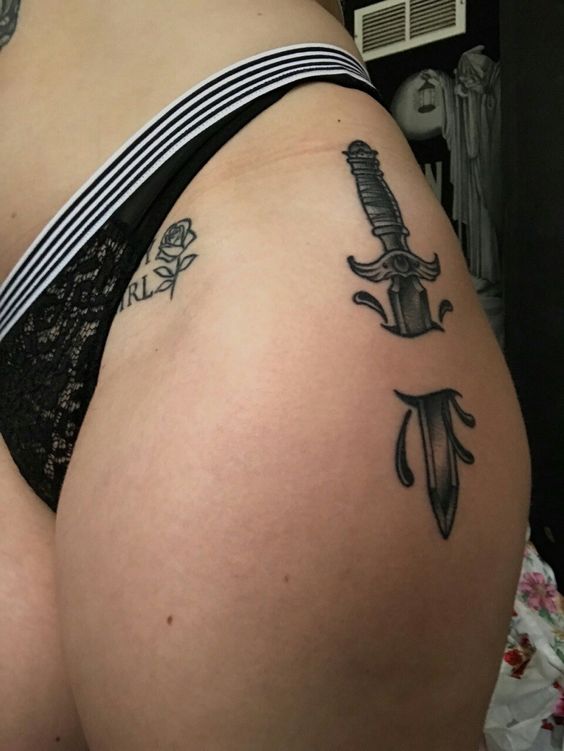 Classic dagger tattoo on the left hip