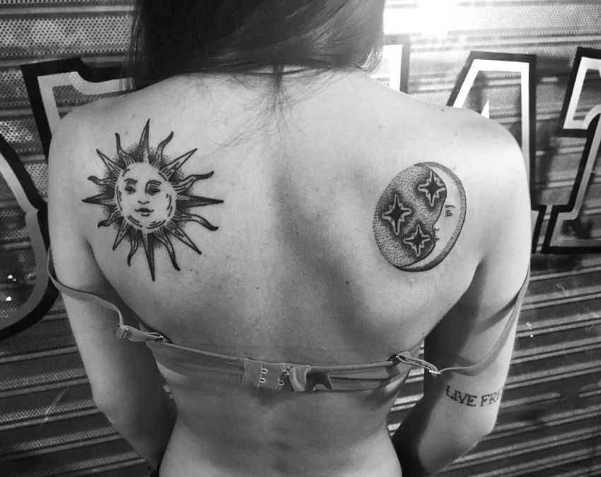 Classic sun and moon tattoos on both shoulder blades