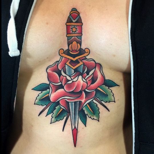 Colorful dagger stabbed rose sternum tattoo