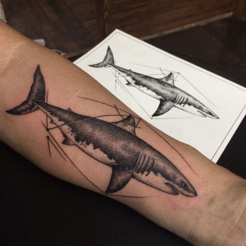 Cool blackwork tattoo of a shark on the left forearm