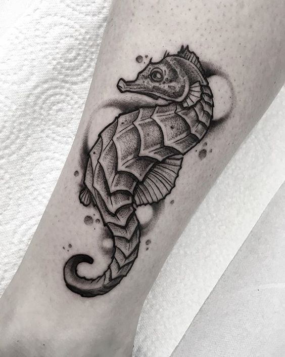 Cute tattoo of a blackwork style seahorse