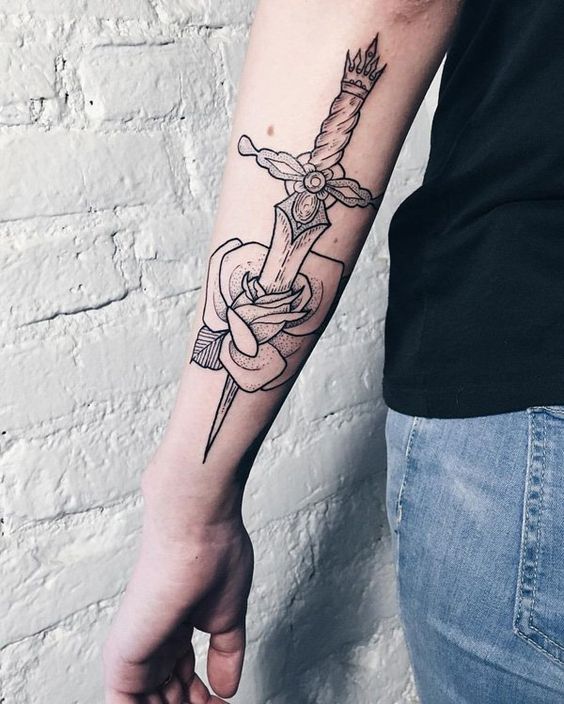 Dagger stabbed rose tattoo on left forearm