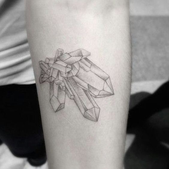 Delicate minimal crystal cluster tattoo on the left arm
