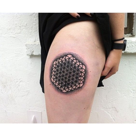 Dense flower of life tattoo on the left thigh