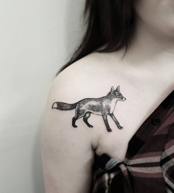 Dotwork black fox tattoo on the right shoulder