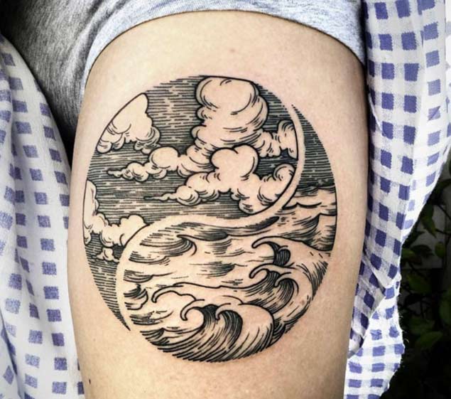 Dotwork black tattoo of yin and yan sky and ocean