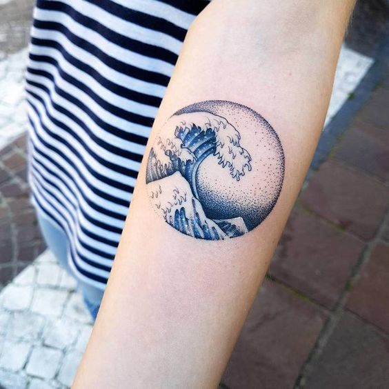 Dotwork circular wave tattoo on the left arm