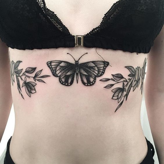 Dotwork style black moth sternum tattoo