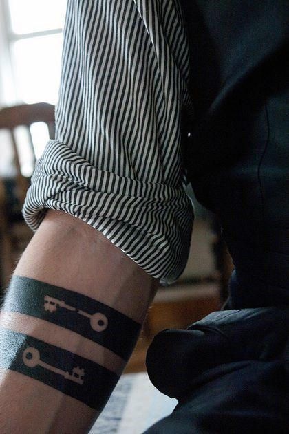 Double negative space key armbands tattoo