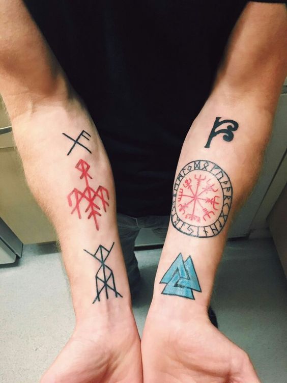 Five different nordic tattoos on both arms