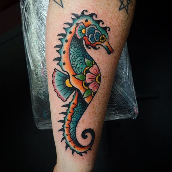 Floral seahorse tattoo on the forearm