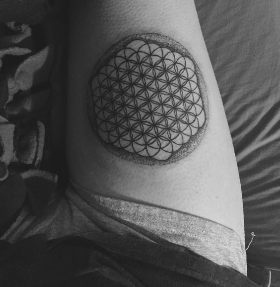 Flower of life tattoo on a thigh