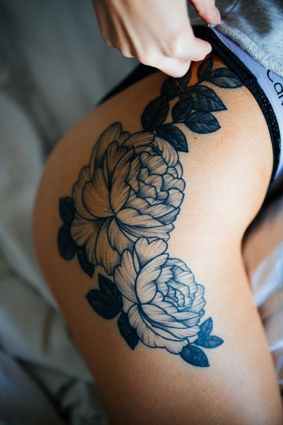 Flower tattoo over the right hip and thigh