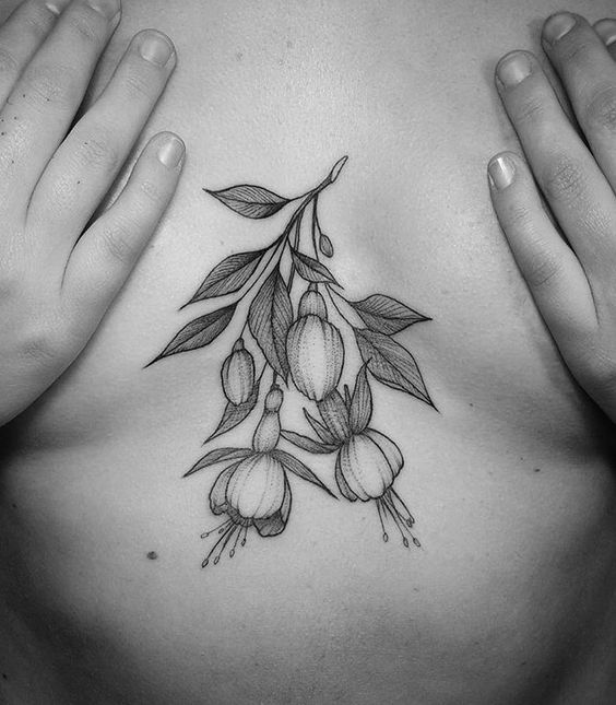 Flowers and leaves tattoo on the sternum