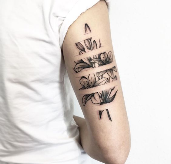 Flowers with five negative space stripes tattoo on the arm