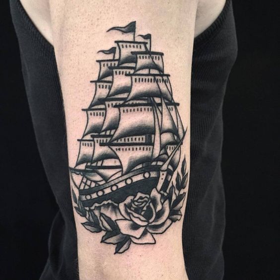 Full rigged black ship tattoo on the right upper arm by anem