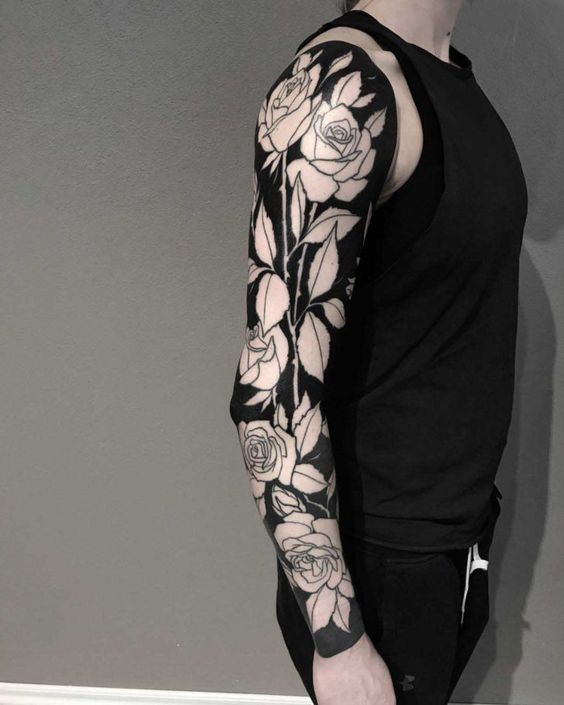 Full sleeve negative space rose tattoo