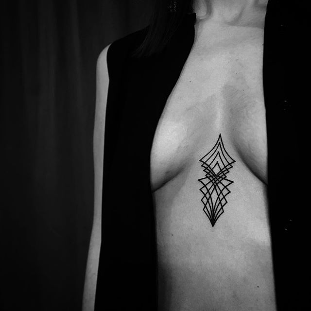 Geometric black sternum tattoo