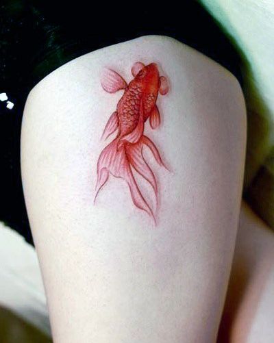 Golden Koi Fish tattoo on the thigh