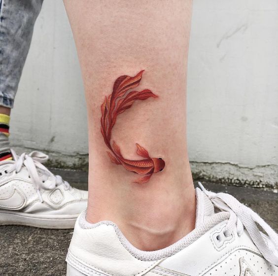Goldfish tattoo by Anastasia Slutskaya
