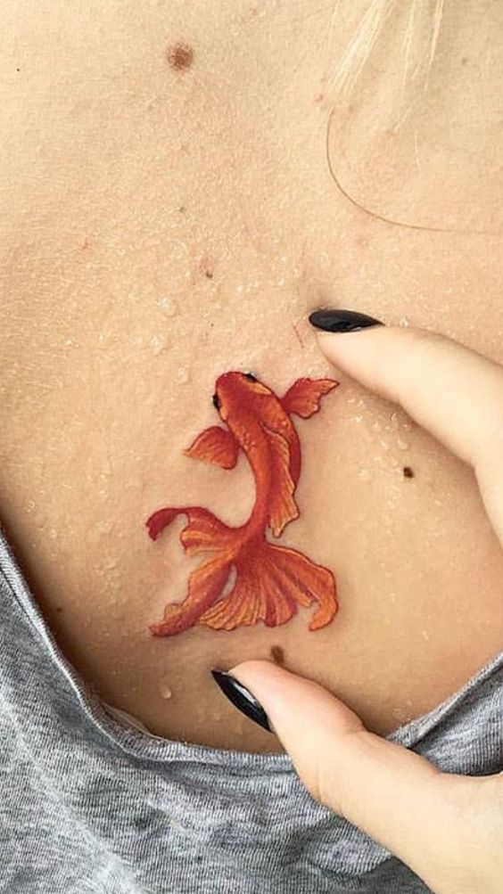 Goldfish tattoo on the back