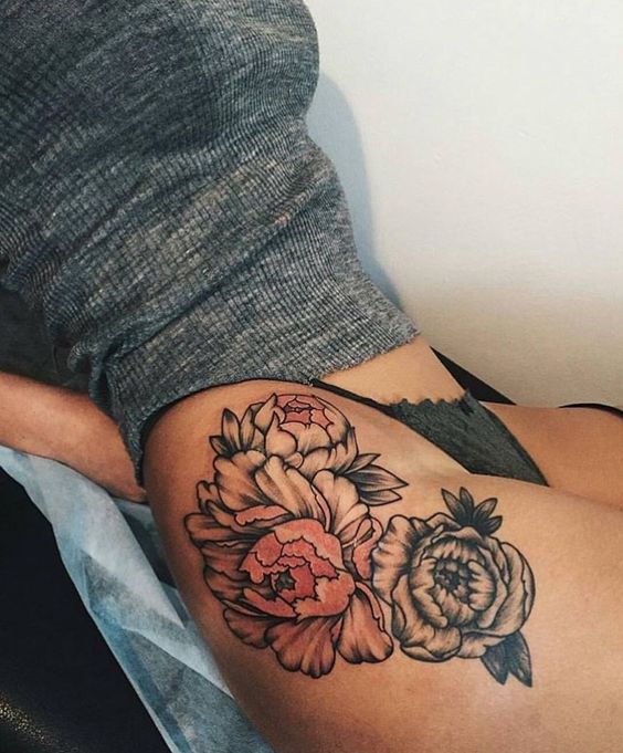 Gorgeous peonies tattoo on the right hip