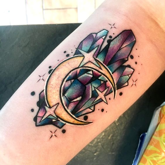 Green and violet fluorite crystal tattoo with a crescent moon