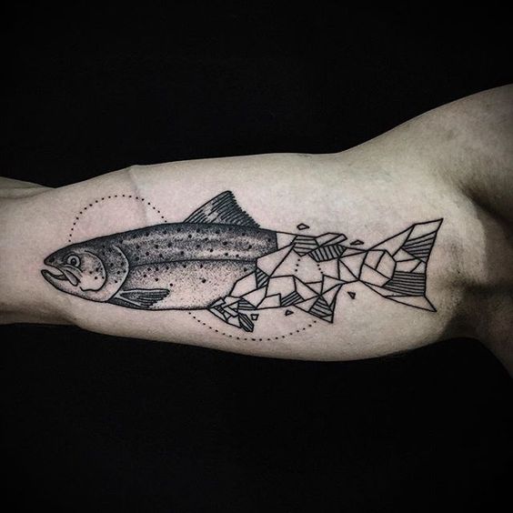 Half geometric fish tattoo on the arm
