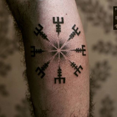 Handpoke tattoo of a viking symbol aegishjalmur