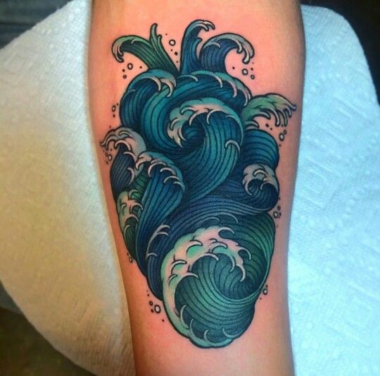 Heart shaped blue wave tattoo
