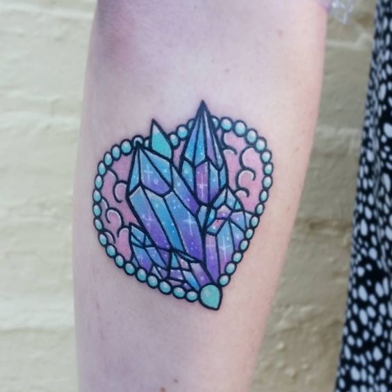 Heart shaped crystal tattoo on the inner arm