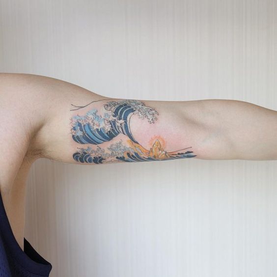 Hokusai wave tattoo on the left bicep