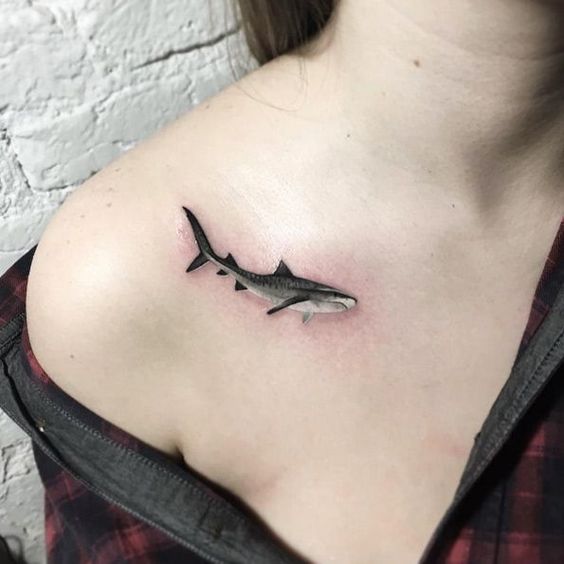 Hyper realistic shark tattoo on the right clavicle bone