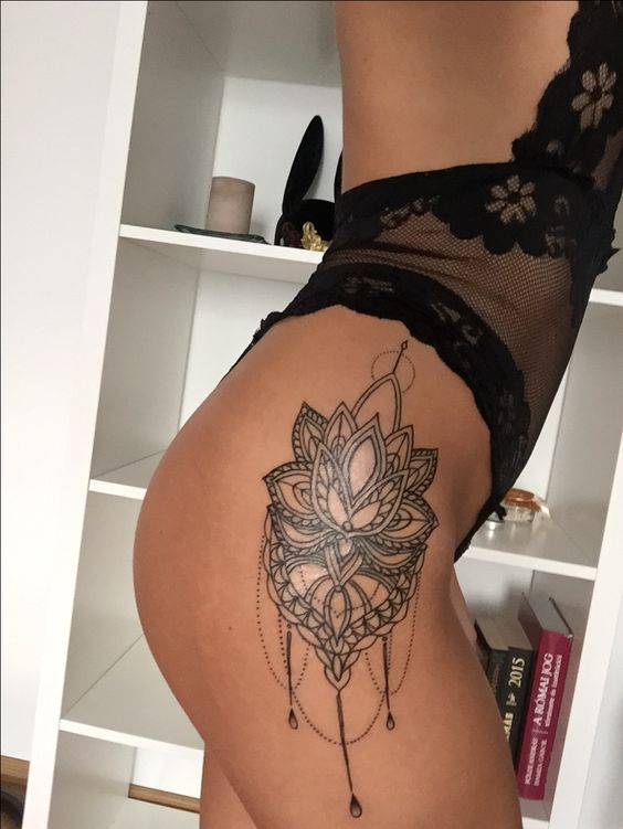 Insanely attractive lotus flower tattoo on the right hip