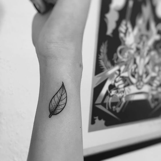 Little black leaf tattoo on the wrist