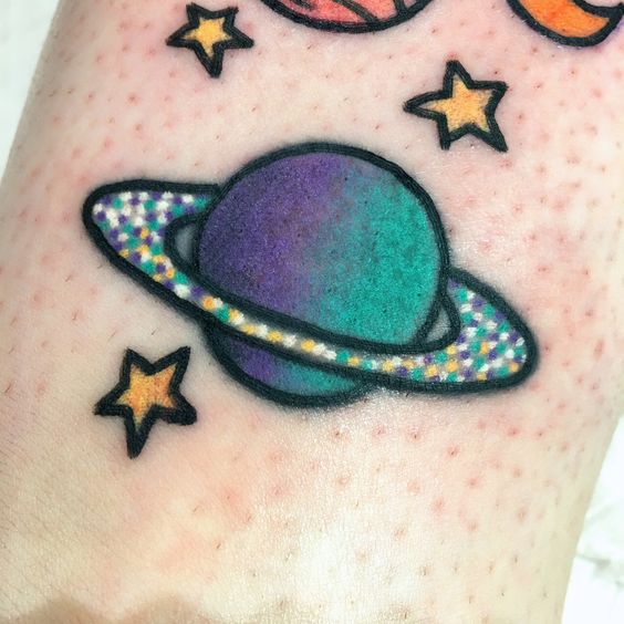 Little colorful tattoo of a planet saturn