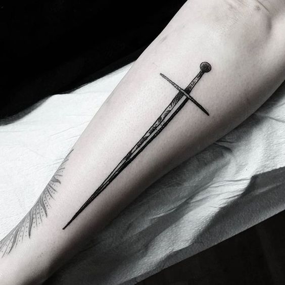 Long black sword tattoo on the arm