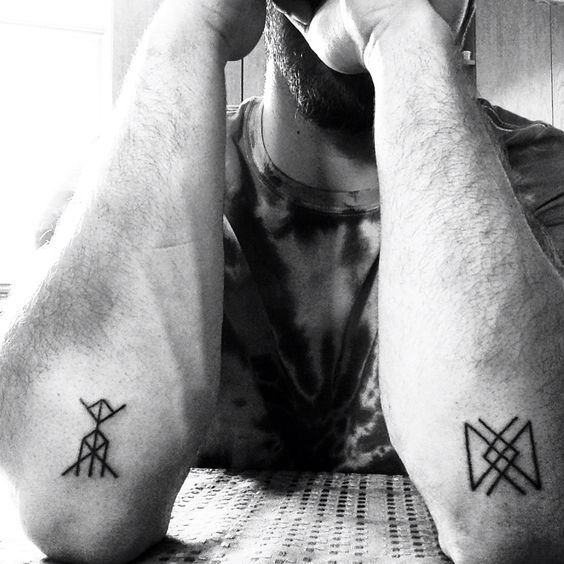 Longevity and vitality rune tattoos on forearms