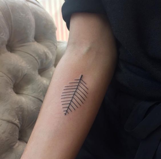 Minimal style leaf tattoo on the right arm