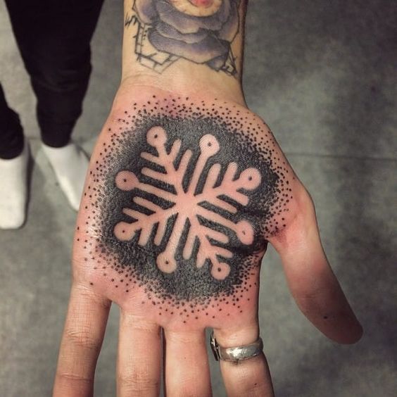 Negative space snowflake palm tattoo by mikki bold