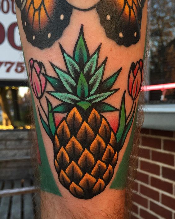 Neo traditional pineapple and tulips tattoo
