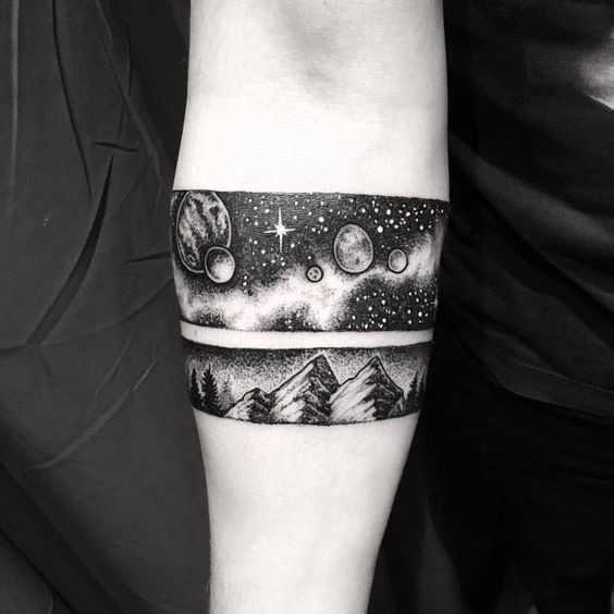 Night sky and cosmic landscape armband tattoo