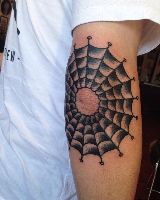 Old school spider web tattoo on the elbow