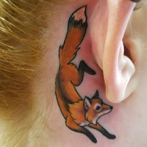 Realistic fox tattoo behind the ear