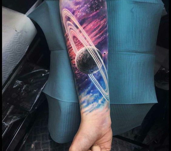 Realistic saturn tattoo with cosmic background
