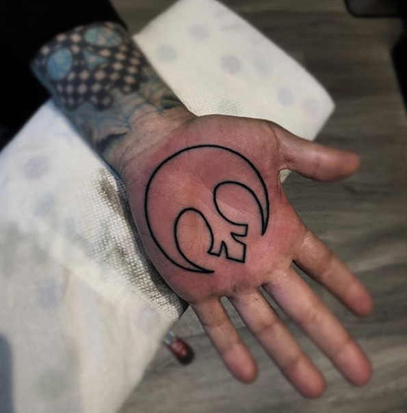 Rebel alliance symbol tattoo on the left palm