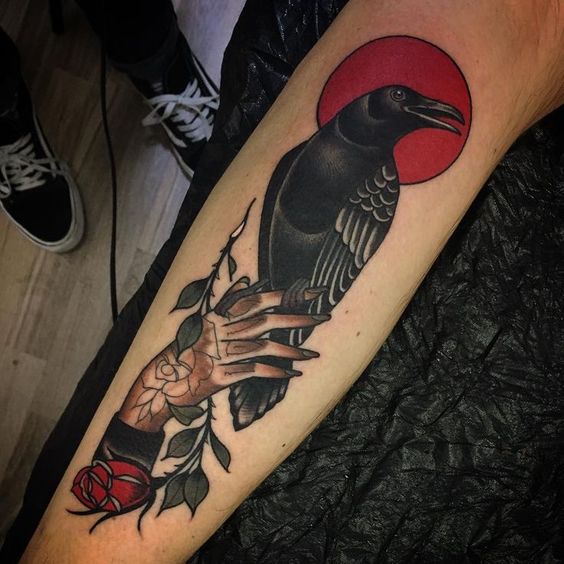Red sun raven and rose traditional tattoo
