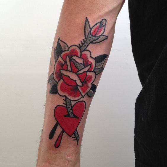 Rose stabbed heart tattoo on the arm by james craddock